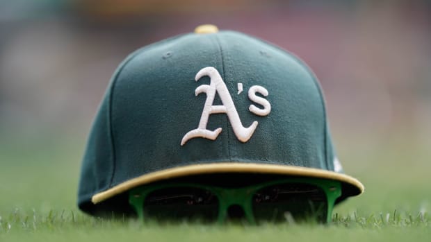 A's hat, Coliseum grass, 2019